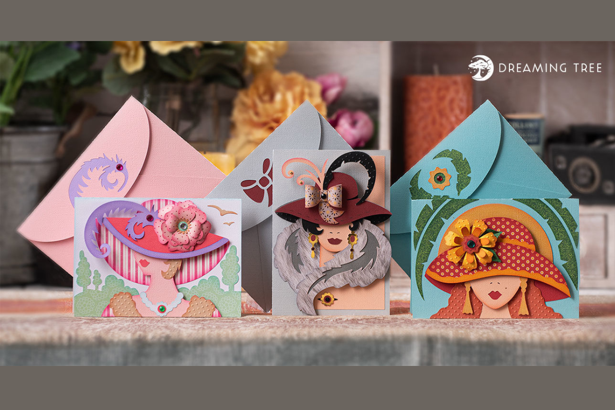 Three paper cards with women in hats, two wide and one tall