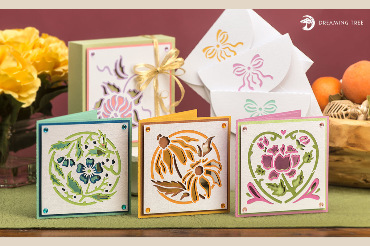 Three square floral cards and a matching paper gift box